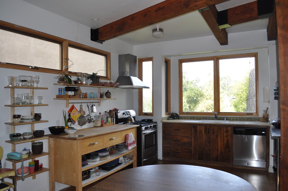 Mid-sized midcentury u-shaped open plan kitchen in San Francisco with a drop-in sink, open cabinets, light wood cabinets, wood benchtops, multi-coloured splashback, mosaic tile splashback, stainless steel appliances, bamboo floors and a peninsula.