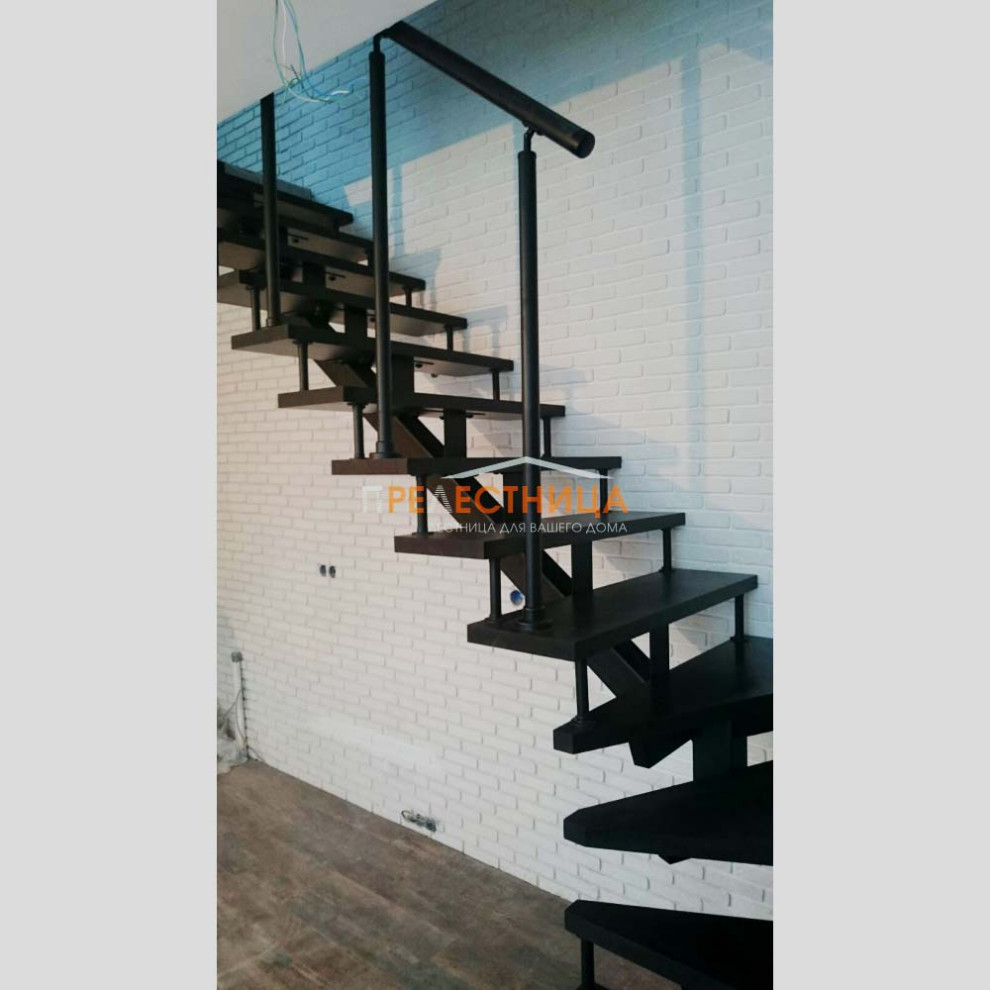 Mid-sized painted wood l-shaped staircase in Other with mixed railing and brick walls.