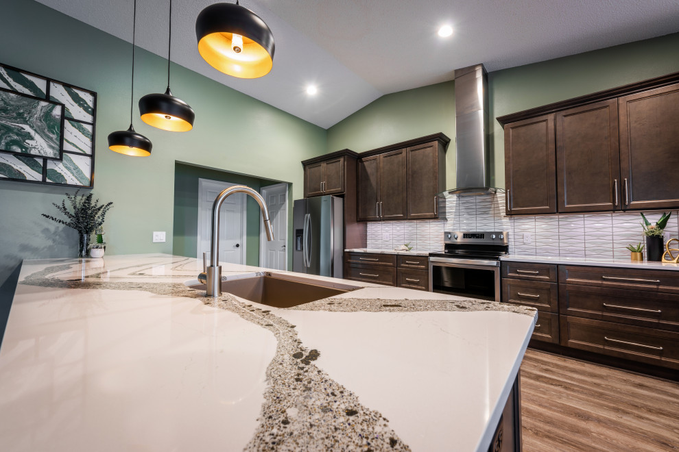 Huge transitional single-wall vinyl floor and gray floor eat-in kitchen photo in Orlando with an undermount sink, recessed-panel cabinets, gray cabinets, quartz countertops, white backsplash, porcelain backsplash, stainless steel appliances, an island and white countertops