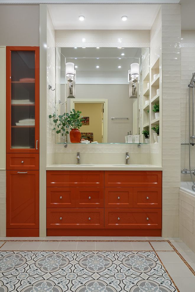 Transitional master bathroom in Saint Petersburg with orange cabinets, an alcove tub, white tile, an undermount sink, multi-coloured floor, white benchtops and recessed-panel cabinets.