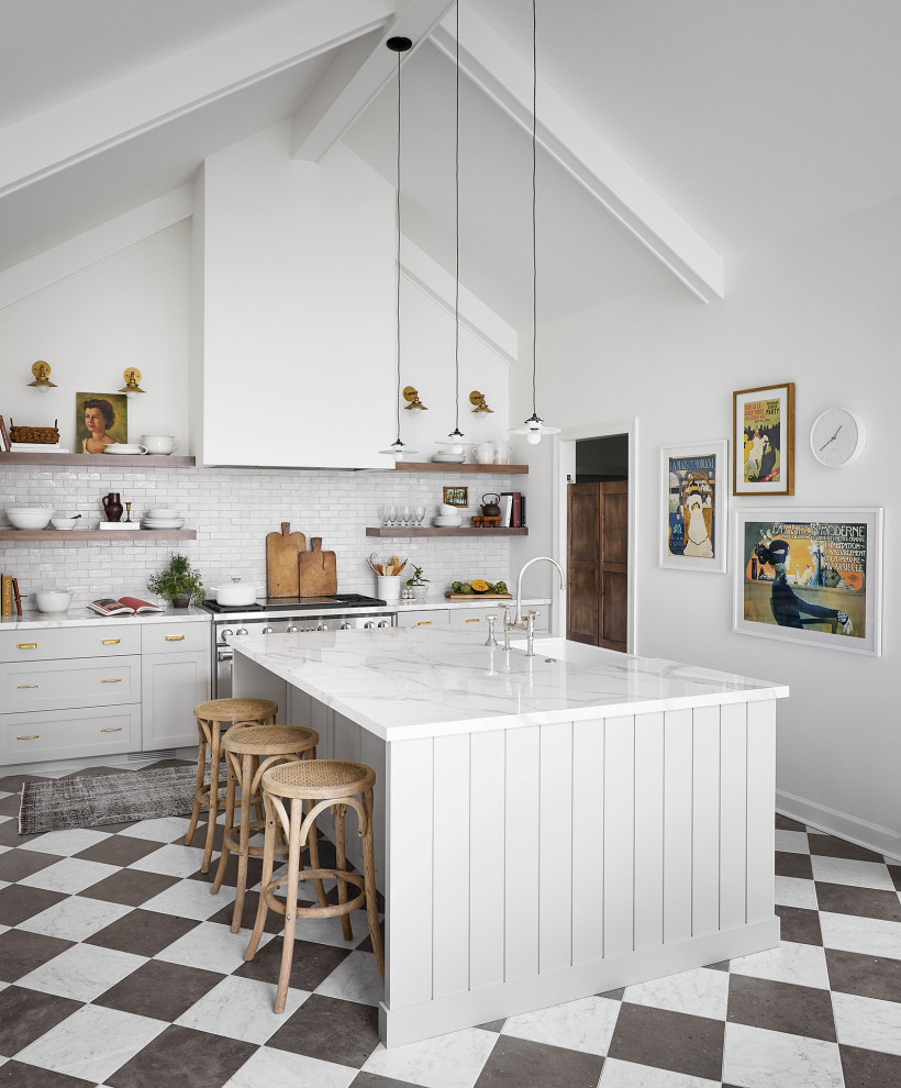 This is an example of a large transitional u-shaped eat-in kitchen in Chicago with a farmhouse sink, shaker cabinets, grey cabinets, white splashback, terra-cotta splashback, stainless steel appliances, marble floors, with island, multi-coloured floor and white benchtop.