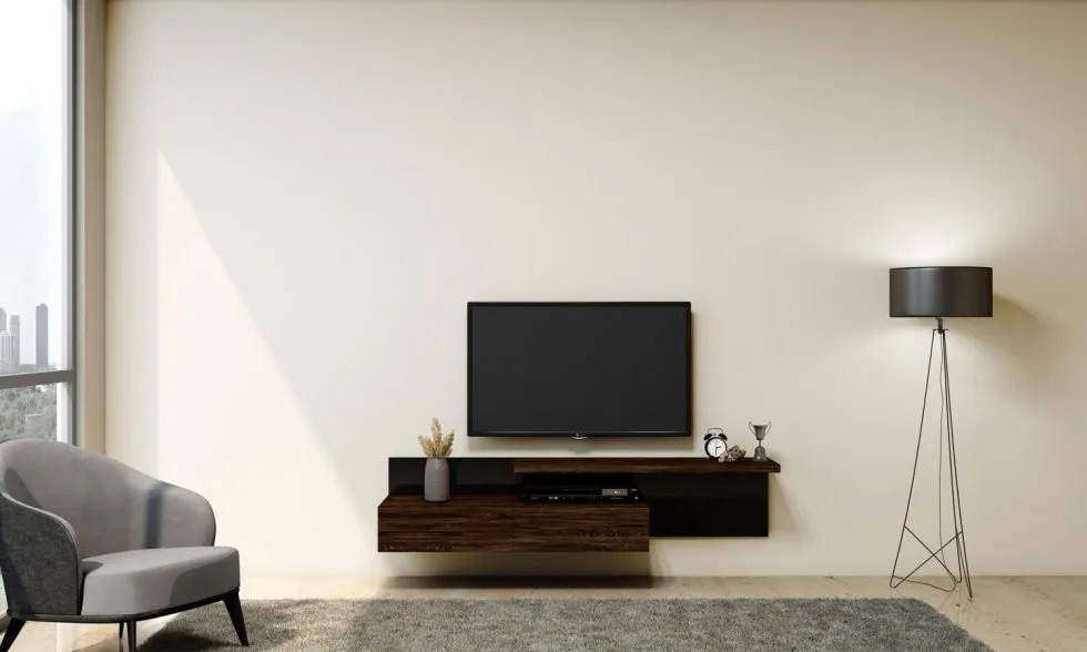Esempio di un piccolo home theatre minimalista aperto con TV a parete
