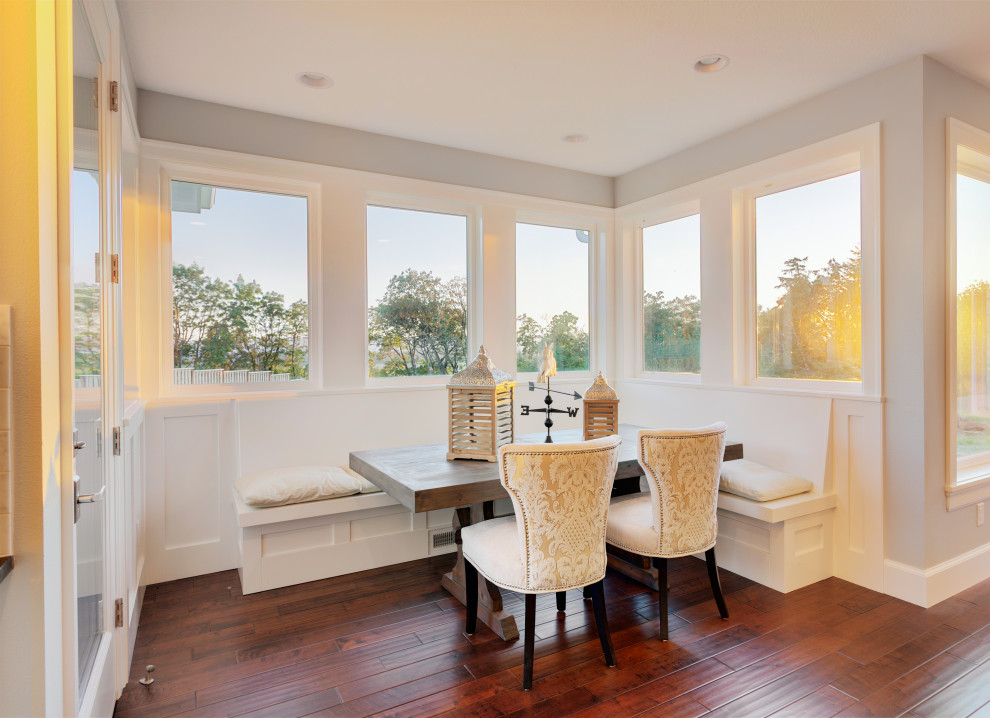 Design ideas for a mid-sized transitional dining room in Tampa with medium hardwood floors.