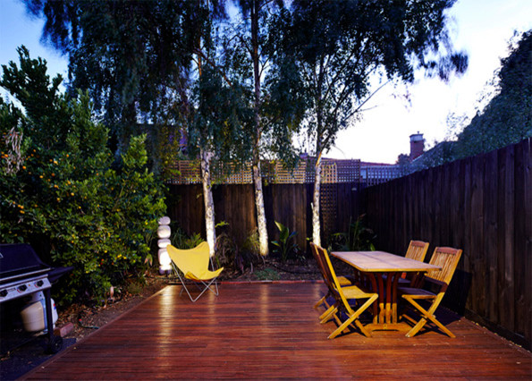 Small contemporary backyard deck in Melbourne with decking.