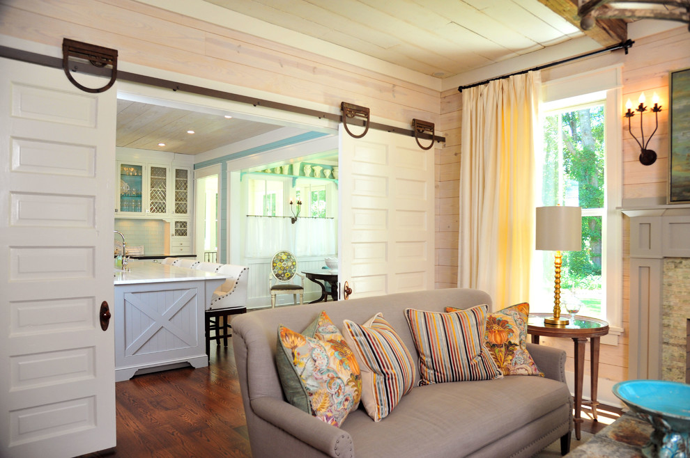 Inspiration for a farmhouse medium tone wood floor living room remodel in Atlanta