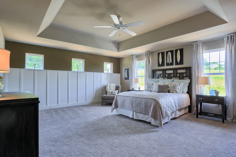 Design ideas for an expansive traditional master bedroom in Philadelphia with beige walls and carpet.