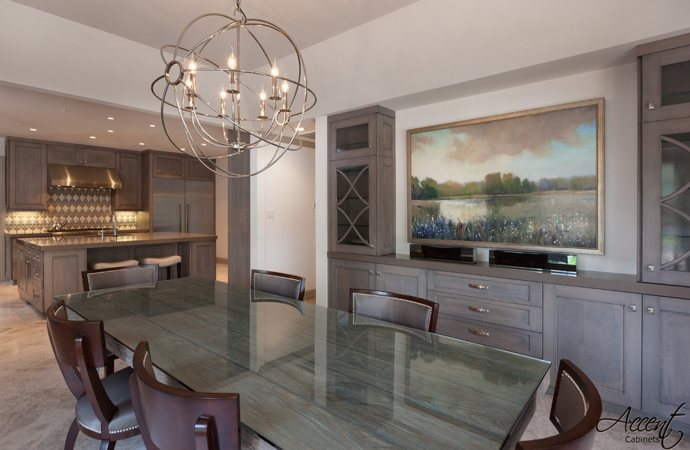 Eat-in kitchen - large transitional u-shaped limestone floor eat-in kitchen idea in Houston with an integrated sink, raised-panel cabinets, medium tone wood cabinets, quartz countertops, multicolored backsplash, stone slab backsplash, paneled appliances and an island