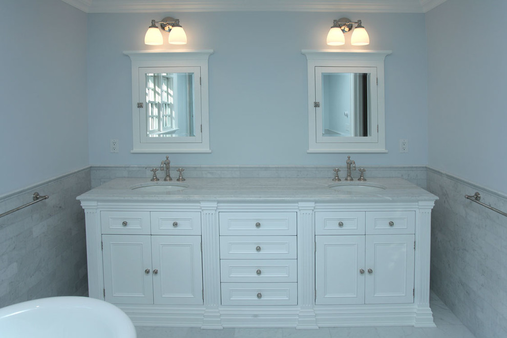 Design ideas for a large transitional master bathroom in New York with an undermount sink, recessed-panel cabinets, white cabinets, marble benchtops, a freestanding tub, an alcove shower, a two-piece toilet, gray tile, subway tile, blue walls and mosaic tile floors.