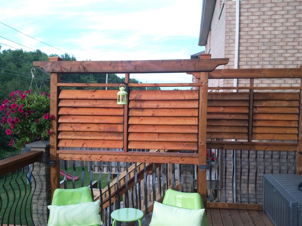 This is an example of a small traditional backyard deck in Toronto with no cover.