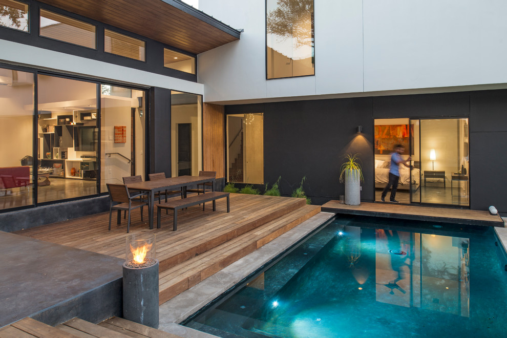 Inspiration for a contemporary two-story pool remodel in Austin
