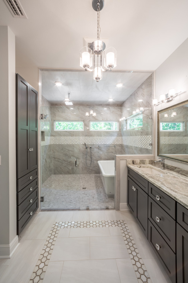 Mid-sized elegant master multicolored tile and porcelain tile porcelain tile, white floor and double-sink freestanding bathtub photo with recessed-panel cabinets, gray cabinets, a one-piece toilet, white walls, an integrated sink, quartzite countertops, a hinged shower door, multicolored countertops and a built-in vanity