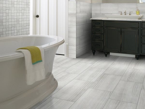 Large transitional master gray tile and stone tile ceramic tile freestanding bathtub photo in Toronto with dark wood cabinets, granite countertops, gray walls and a drop-in sink
