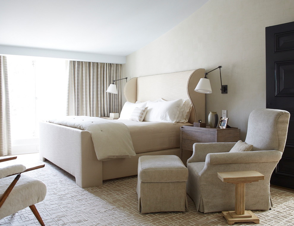 Photo of a large modern master bedroom in New York with beige walls, dark hardwood floors and brown floor.