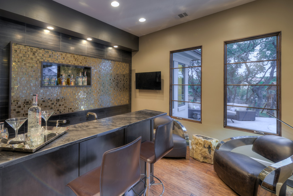 Small transitional single-wall wet bar in Austin with flat-panel cabinets and dark wood cabinets.