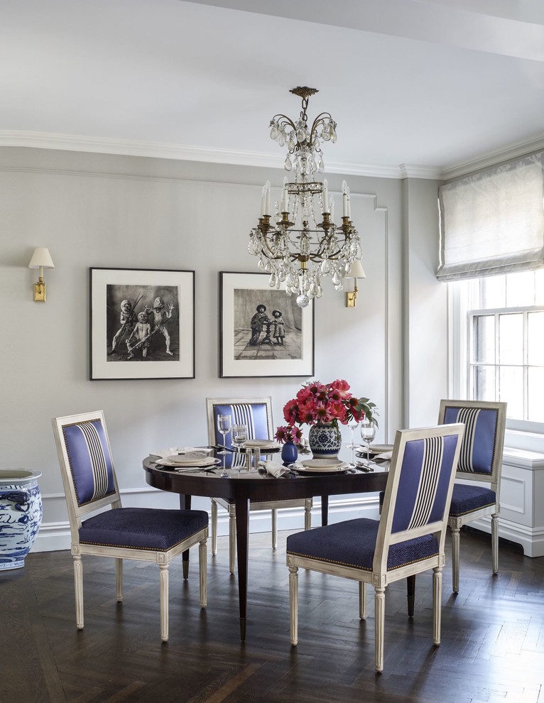 Inspiration for a traditional dining room in New York with grey walls and dark hardwood floors.