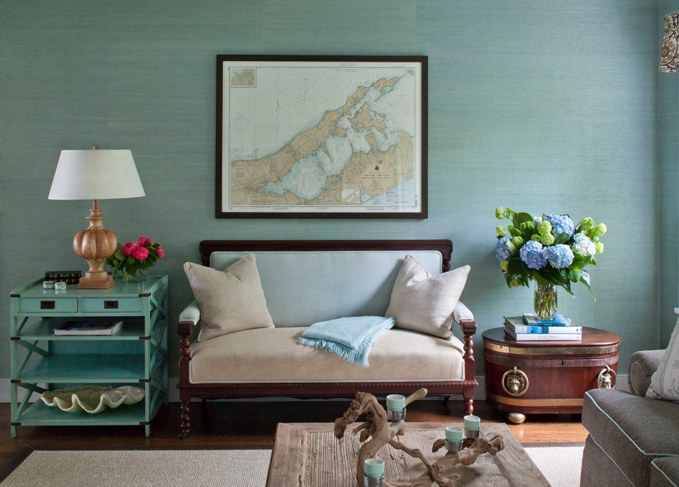 Inspiration for a beach style living room in New York with green walls and medium hardwood floors.
