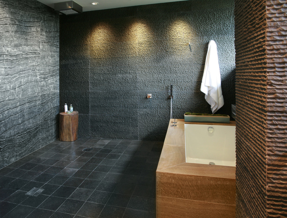 Inspiration for a modern bathroom in Los Angeles with an undermount tub, an open shower, gray tile and an open shower.