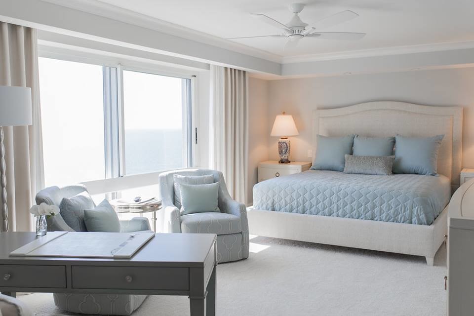 Inspiration for a mid-sized beach style master bedroom in Miami with grey walls, carpet and no fireplace.