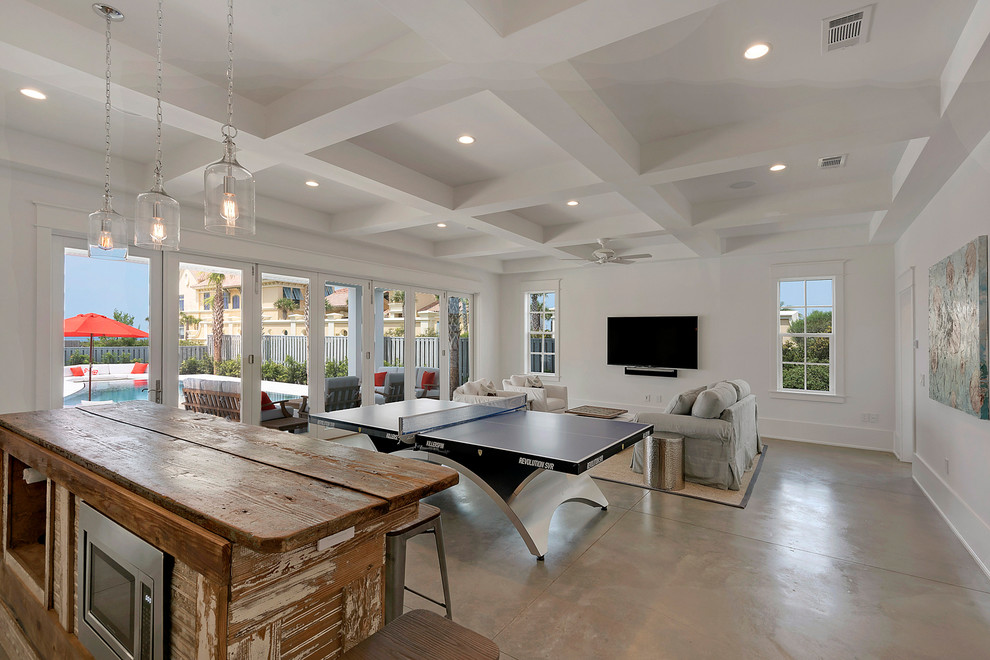 Photo of a large country enclosed family room in Miami with a game room, white walls, concrete floors, no fireplace and no tv.