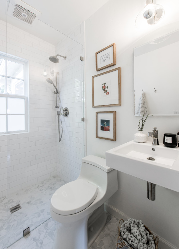 Design ideas for a traditional bathroom in San Francisco with a one-piece toilet, white tiles, porcelain tiles, white walls, porcelain flooring, grey floors, an open shower, a single sink and a freestanding vanity unit.