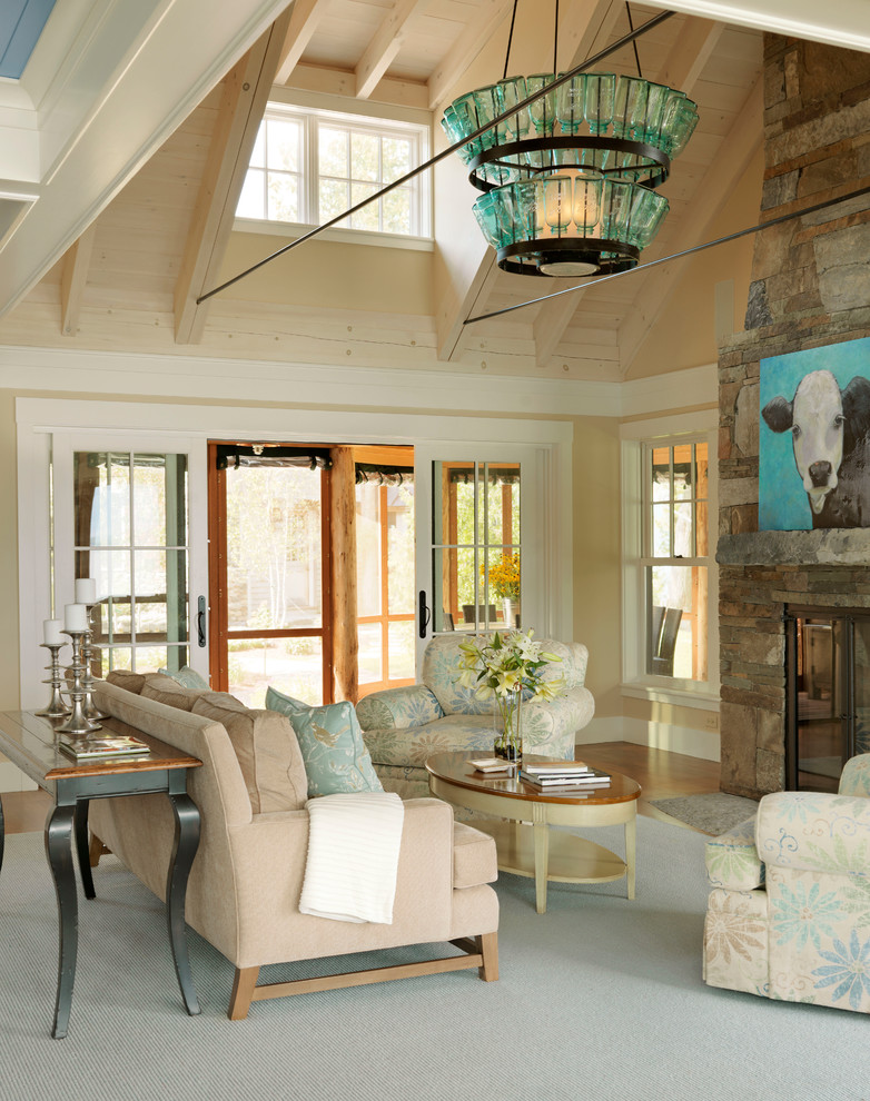 Example of a beach style formal living room design in Burlington with beige walls, a standard fireplace and a stone fireplace