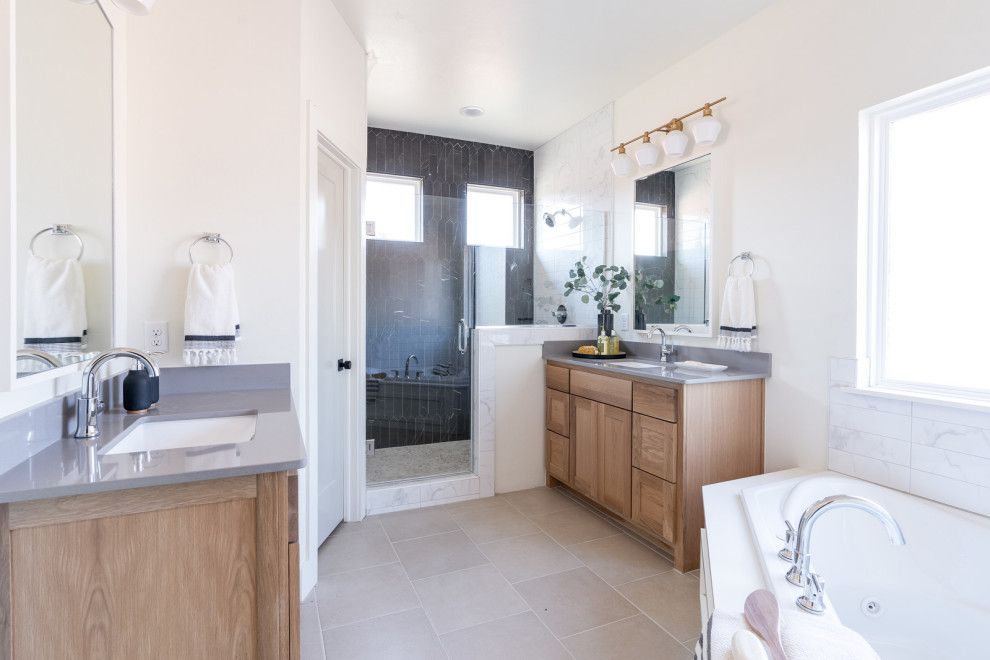 Mid-sized country master bathroom in Oklahoma City with shaker cabinets, light wood cabinets, a corner tub, an alcove shower, a one-piece toilet, white tile, subway tile, black walls, marble floors, an undermount sink, engineered quartz benchtops, beige floor, a hinged shower door and white benchtops.