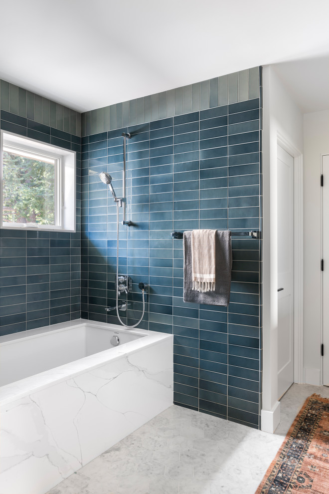 This is an example of a large farmhouse family bathroom in San Francisco with raised-panel cabinets, brown cabinets, a built-in bath, a shower/bath combination, a one-piece toilet, blue tiles, ceramic tiles, white walls, marble flooring, a submerged sink, engineered stone worktops, white floors, a hinged door, white worktops, an enclosed toilet, double sinks and a built in vanity unit.