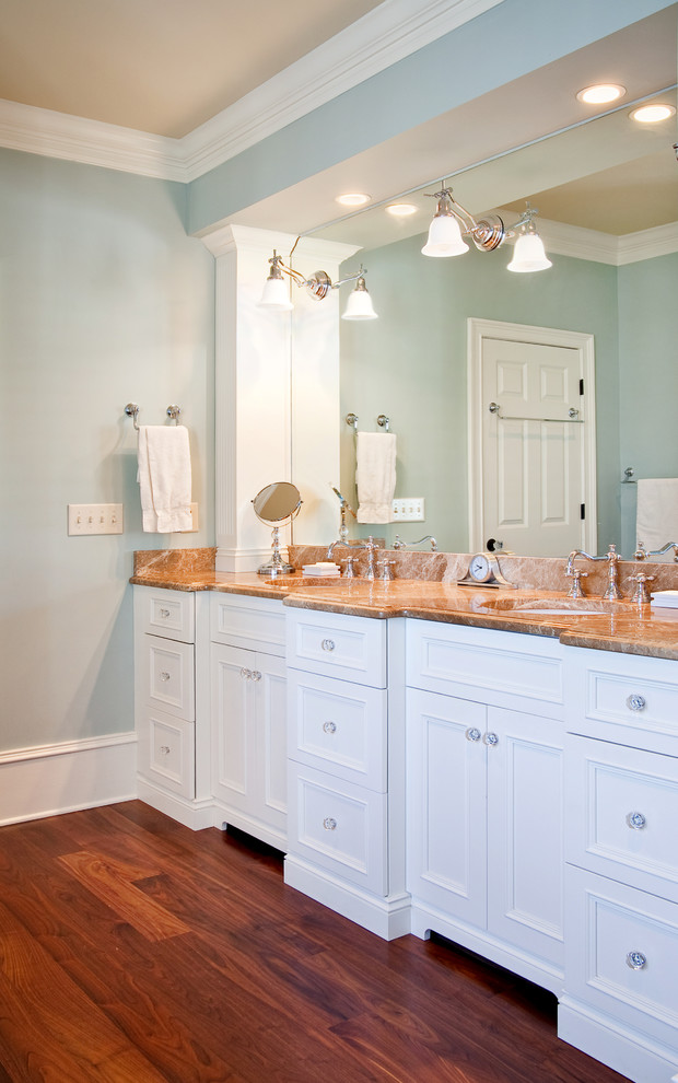 Design ideas for a traditional bathroom in Charleston with recessed-panel cabinets.