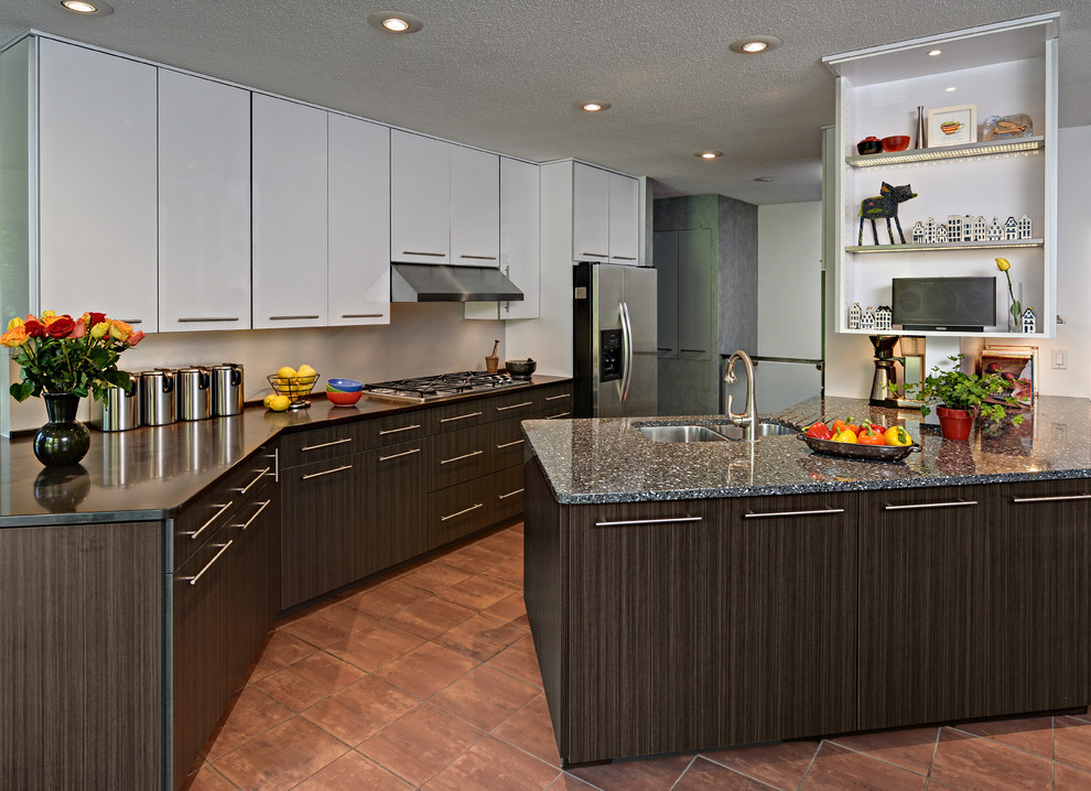 Photo of a mid-sized contemporary galley eat-in kitchen in Minneapolis with an undermount sink, flat-panel cabinets, white cabinets, quartz benchtops, metallic splashback, stainless steel appliances, ceramic floors and a peninsula.