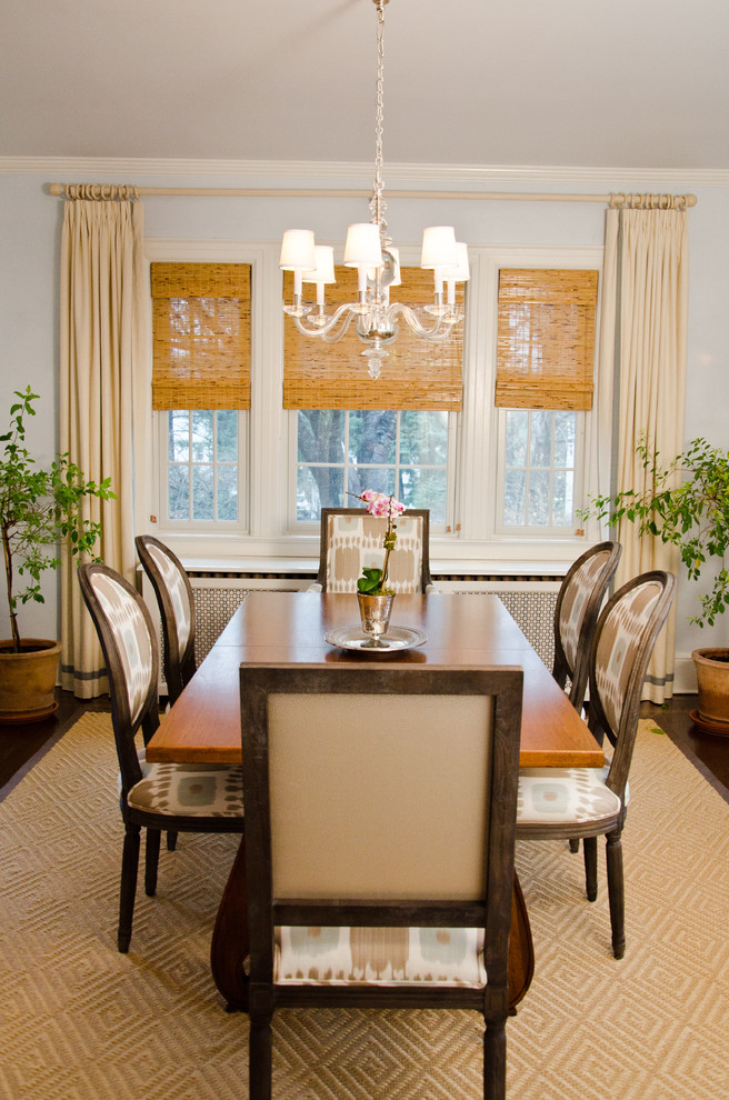 Design ideas for a traditional dining room in New York with blue walls and dark hardwood floors.