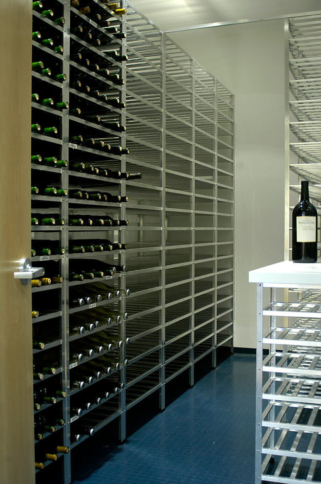 Inspiration for a mid-sized modern wine cellar in San Francisco with linoleum floors and storage racks.