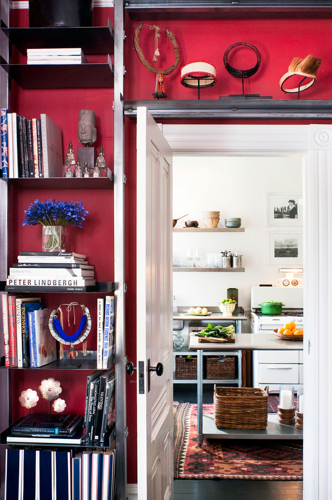 Mid-sized eclectic hallway in San Francisco with red walls and dark hardwood floors.