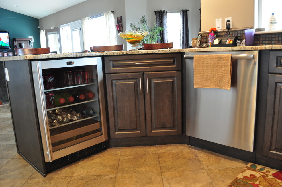 Example of a mid-sized transitional l-shaped porcelain tile eat-in kitchen design in Seattle with an undermount sink, raised-panel cabinets, gray cabinets, granite countertops, multicolored backsplash, mosaic tile backsplash, stainless steel appliances and no island