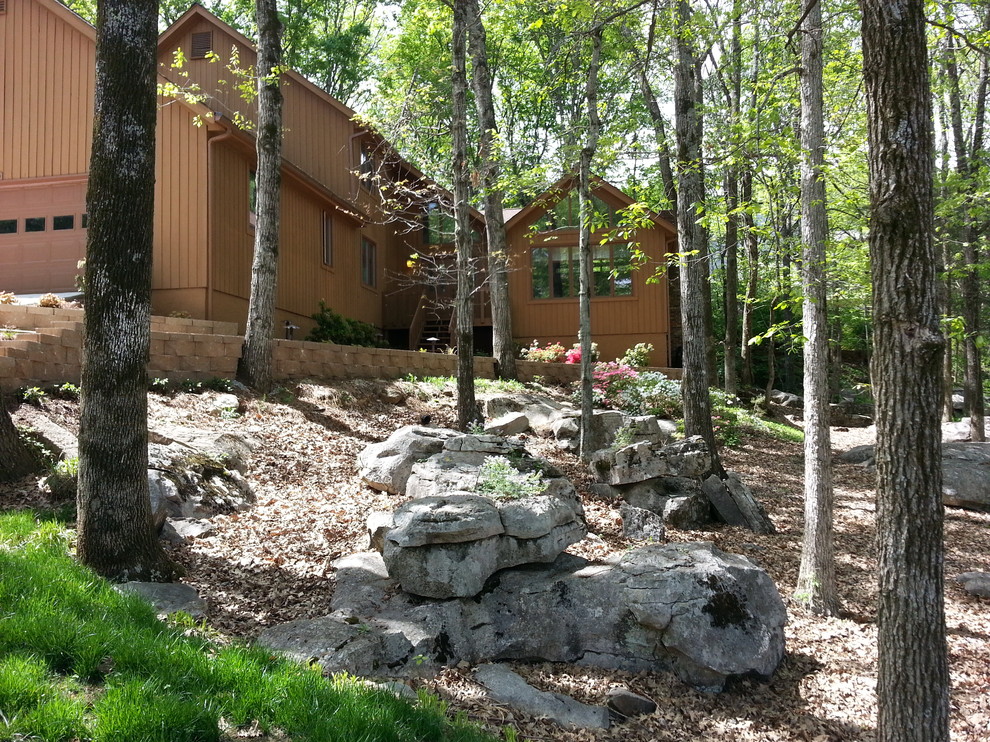 Inspiration for a rustic shade hillside retaining wall landscape for spring.