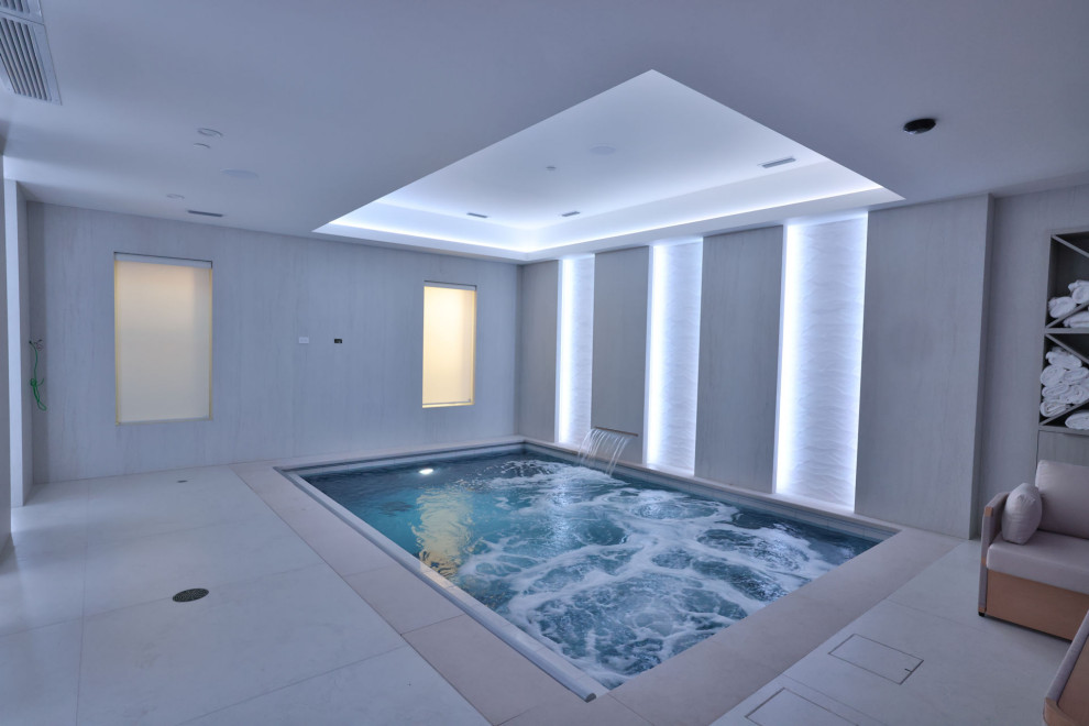 Hot tub - small indoor rectangular hot tub idea in Chicago