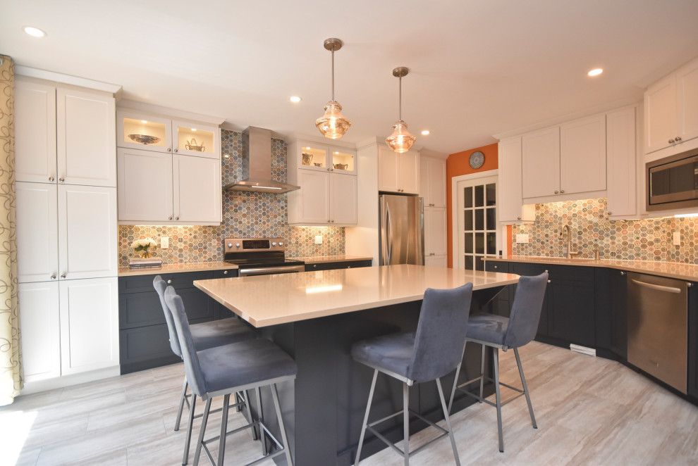 Inspiration for a mid-sized transitional l-shaped vinyl floor and beige floor kitchen remodel in Ottawa with a double-bowl sink, shaker cabinets, white cabinets, quartzite countertops, multicolored backsplash, mosaic tile backsplash, stainless steel appliances, an island and beige countertops