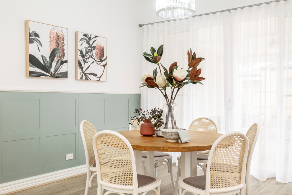 Inspiration for a transitional dining room in Melbourne with white walls, medium hardwood floors, no fireplace, brown floor, panelled walls and decorative wall panelling.