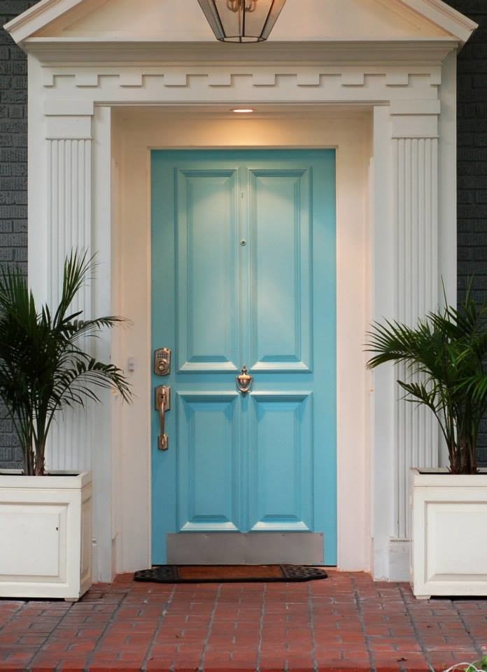 Photo of a transitional front door in Richmond with white walls, brick floors, a single front door and a blue front door.