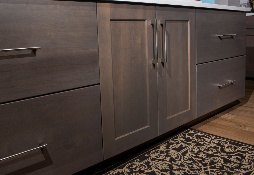 Eat-in kitchen - large transitional u-shaped medium tone wood floor eat-in kitchen idea in Denver with an undermount sink, recessed-panel cabinets, gray cabinets, quartz countertops, white backsplash, ceramic backsplash, stainless steel appliances and two islands