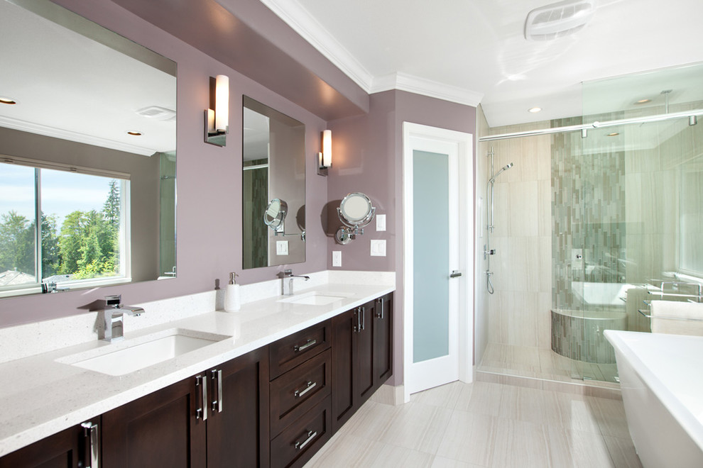 Design ideas for a mid-sized modern master bathroom in Orlando with shaker cabinets, brown cabinets, a freestanding tub, a corner shower, a one-piece toilet, purple walls, an undermount sink, beige floor and an open shower.