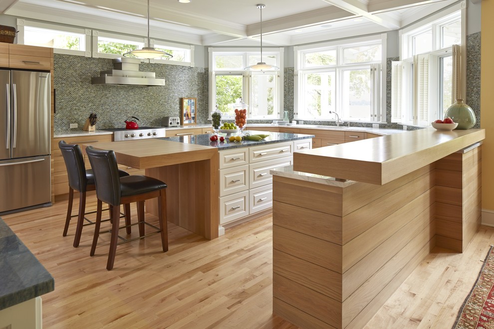 Design ideas for a transitional kitchen in Minneapolis with light wood cabinets and stainless steel appliances.