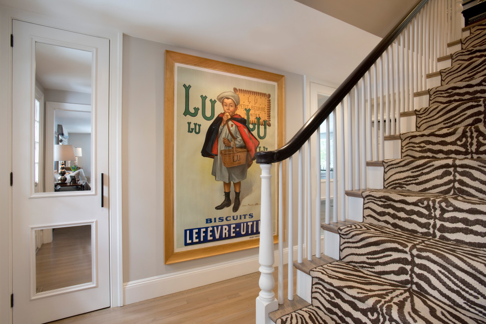 Inspiration for a mid-sized transitional light wood floor and beige floor entryway remodel in Boston with white walls