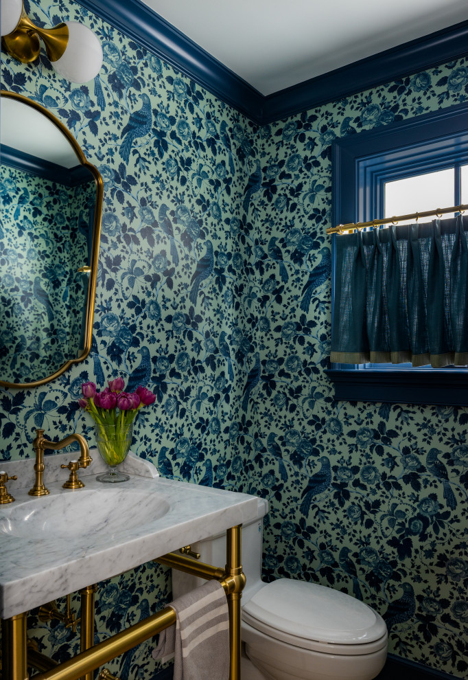 Powder room - small transitional wallpaper powder room idea in New York with multicolored walls, a pedestal sink, marble countertops and a freestanding vanity