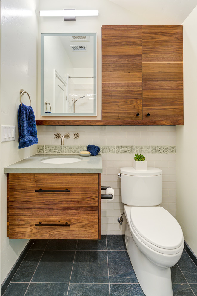 Inspiration for a small modern kids bathroom in San Francisco with flat-panel cabinets, medium wood cabinets, a two-piece toilet, white tile, ceramic tile, white walls, ceramic floors, an undermount sink, engineered quartz benchtops, blue floor and grey benchtops.