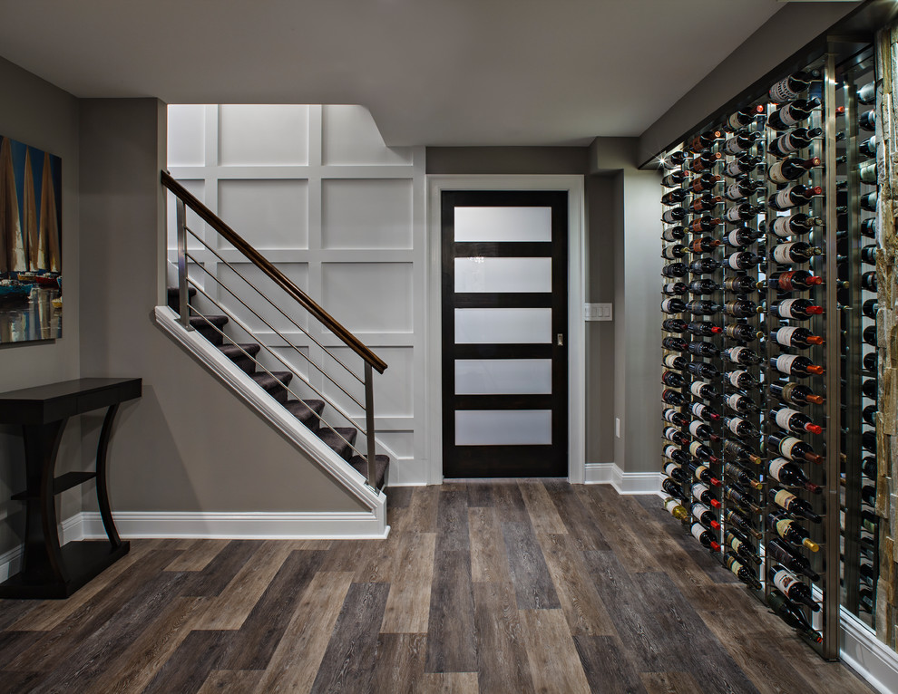 Inspiration for a large contemporary wine cellar in New York with dark hardwood floors and brown floor.