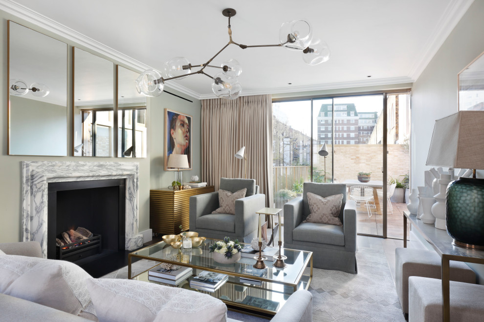 Inspiration for a traditional living room in London with grey walls and a standard fireplace.
