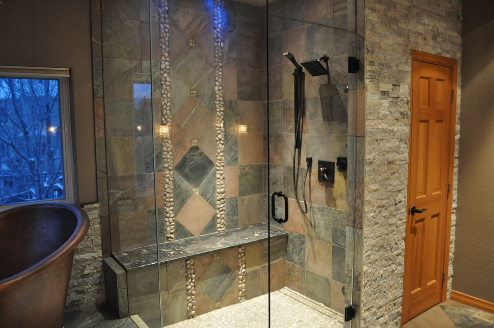 Inspiration for a large traditional bathroom in Denver with granite benchtops, a freestanding tub, gray tile, stone tile, brown walls, slate floors and with a sauna.