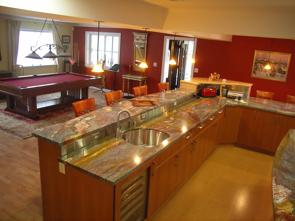 Photo of a large arts and crafts l-shaped kitchen in Sacramento with a double-bowl sink, flat-panel cabinets, medium wood cabinets, granite benchtops, metallic splashback, metal splashback, stainless steel appliances, cork floors and multiple islands.