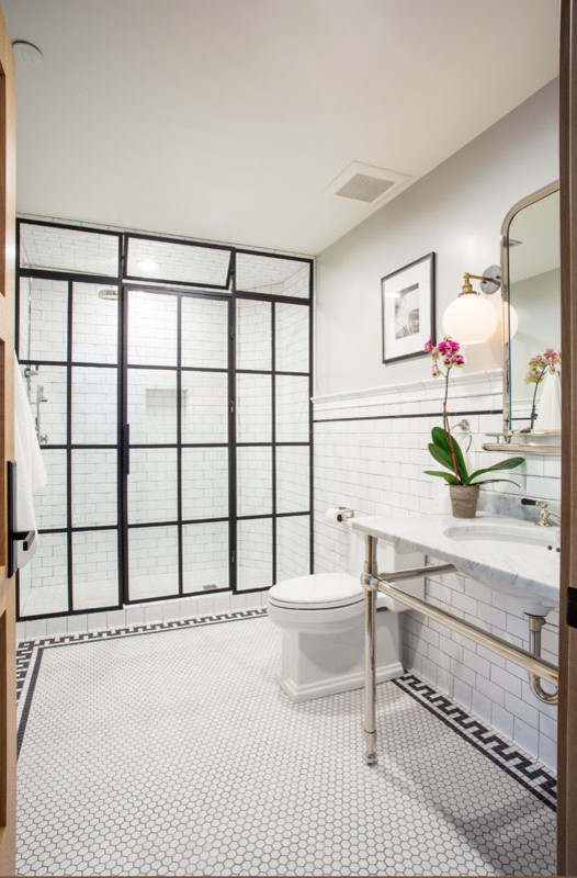 Mid-sized traditional master bathroom in Salt Lake City with an alcove shower, a two-piece toilet, white tile, subway tile, grey walls, porcelain floors, a console sink, marble benchtops, white floor, a hinged shower door and grey benchtops.