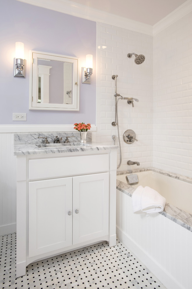 This is an example of a small traditional kids bathroom in DC Metro with marble benchtops, subway tile, purple walls, shaker cabinets, white cabinets, black and white tile, marble floors, an undermount sink and an undermount tub.